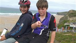 Zac and Ash take a well-earned rest overlooking Watergate Bay, 7.8 miles into the ride